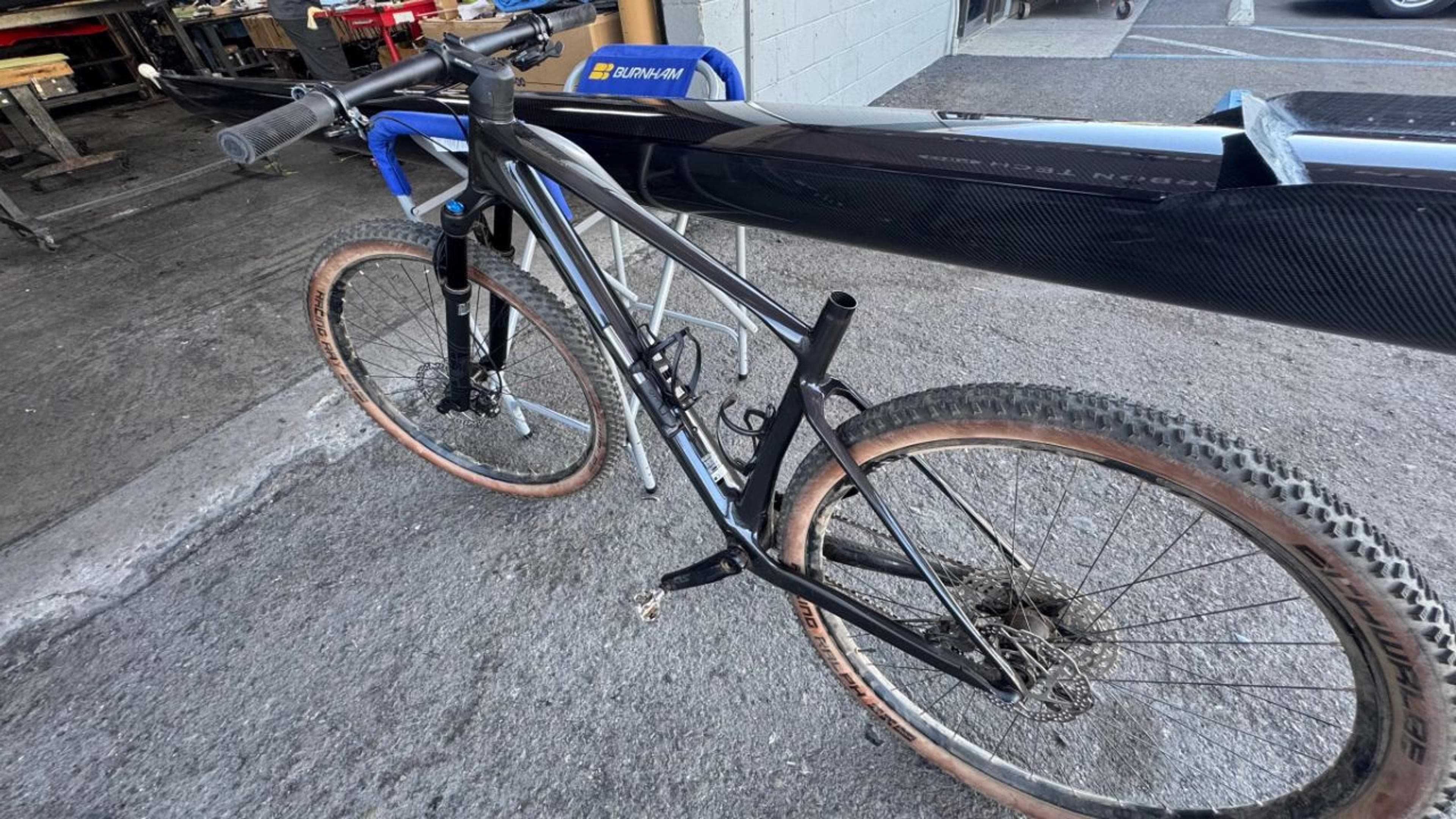 Rear three-quarter view highlighting the restored carbon fiber frame and rear triangle. Rear three-quarter view of repaired Scott Scale RC carbon fiber mountain bike frame