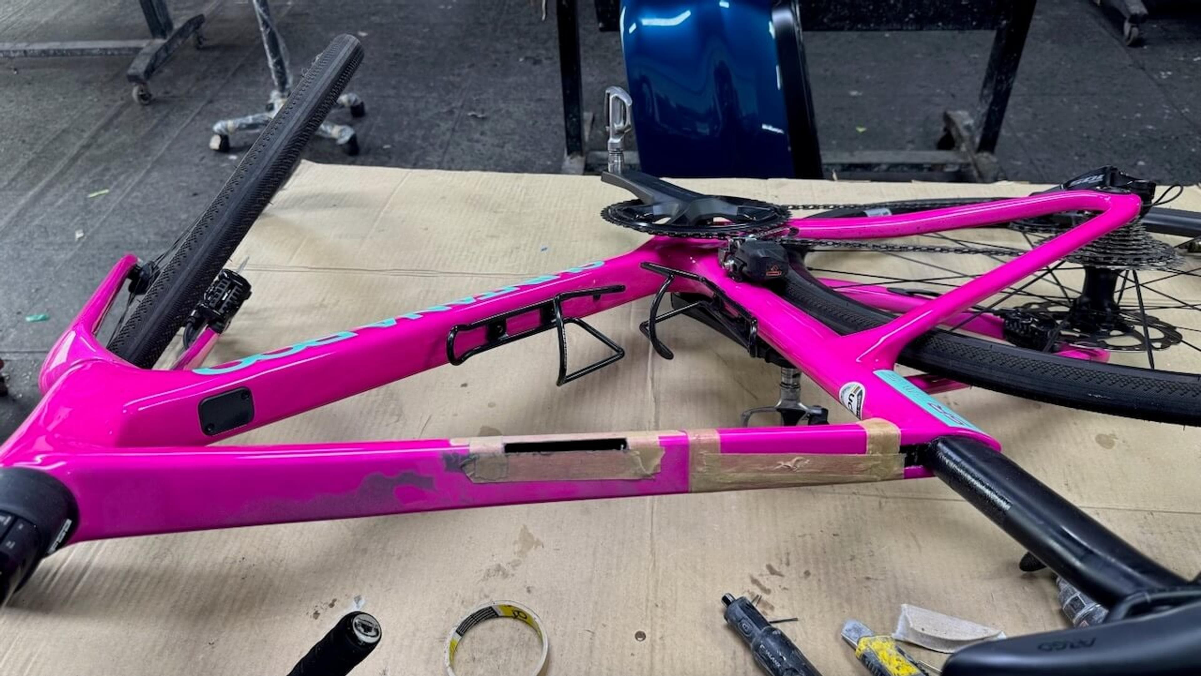 Carbon fiber frame repair in progress Quintana Roo SRfive frame with damaged top tube opened and prepared for carbon fiber repair