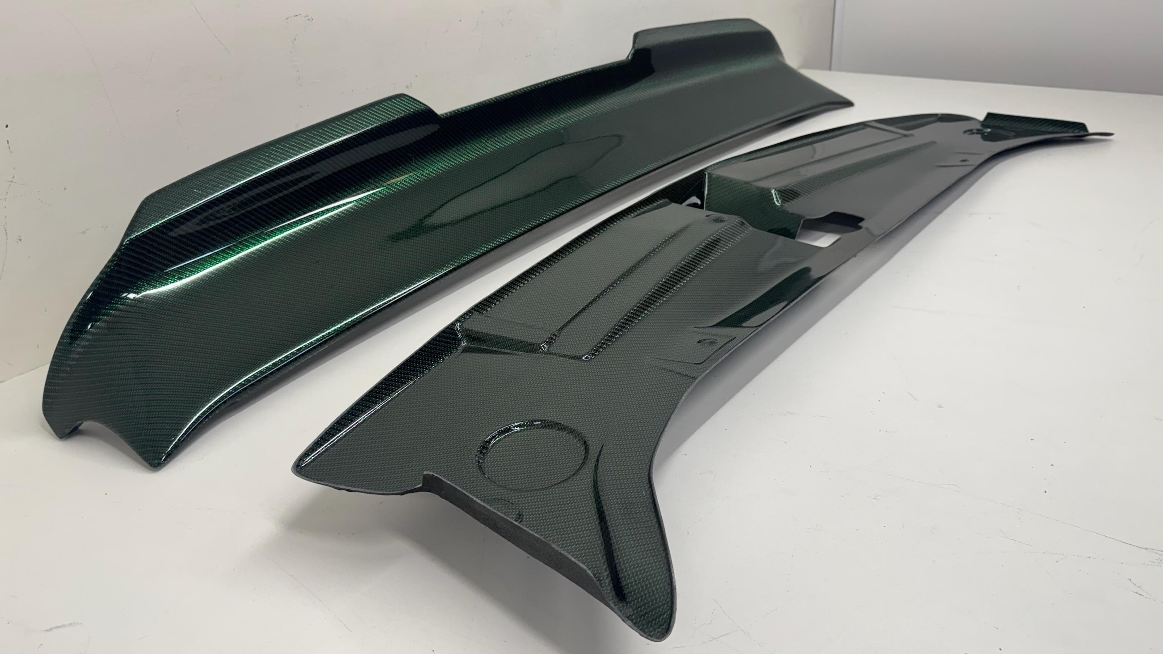 Green twill carbon fiber rear spoiler and radiator cover Green twill carbon fiber spoiler and radiator cover for 2016-2023 Dodge Challenger.