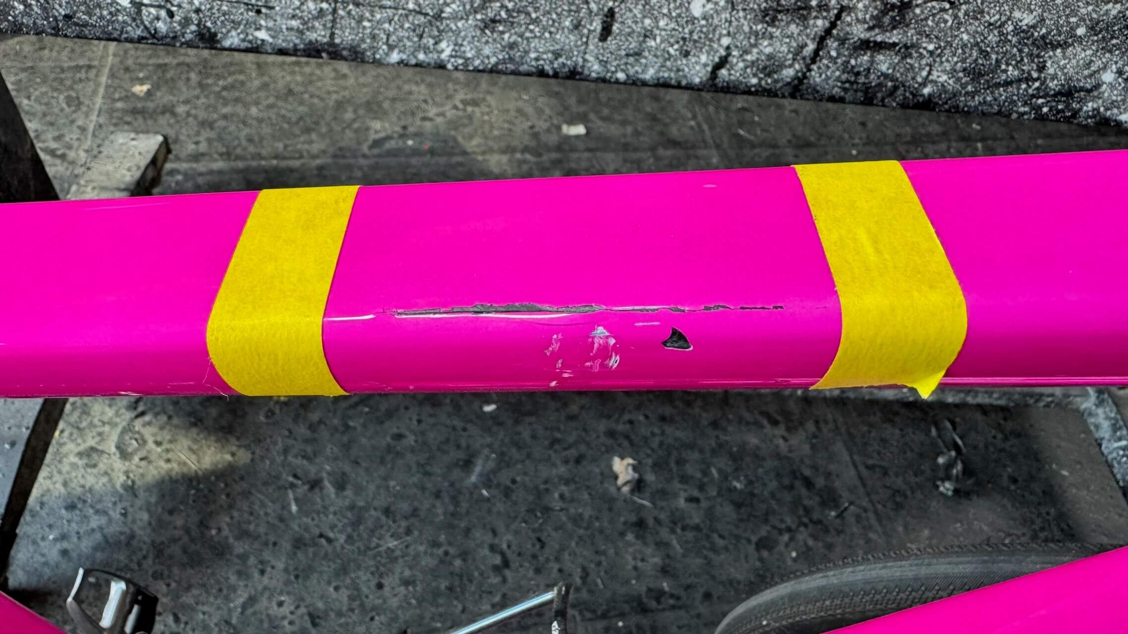 Close-up of the frame damage Crack and surface damage on Quintana Roo SRfive carbon fiber top tube